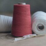 Cotton Yarn - red thread on white paper