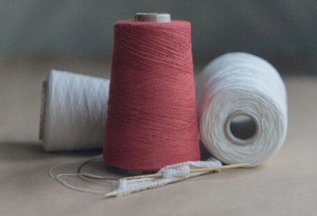 Cotton Yarn - red thread on white paper