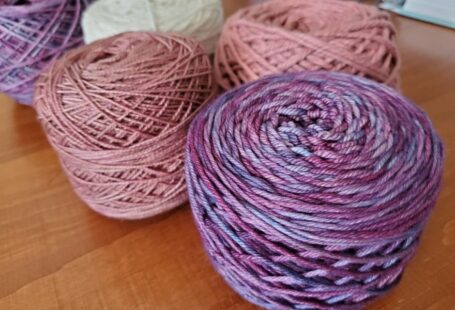 Alpaca Yarn - three balls of yarn sitting on a table