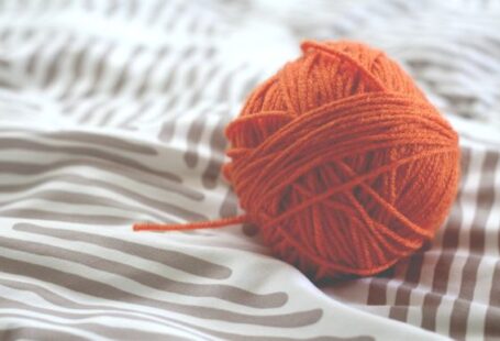 Tencel Yarn - orange yarn ball on white and gray pad