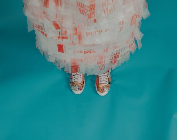 Eco Yarn - person wearing brown-and-white lace-up shoes