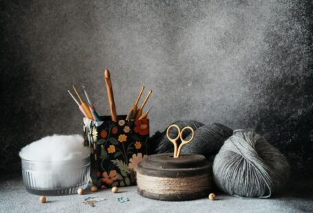 Yarn Tools - a pair of scissors, a ball of yarn, and some knitting needles