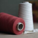 Yarn Tools - red thread on white paper