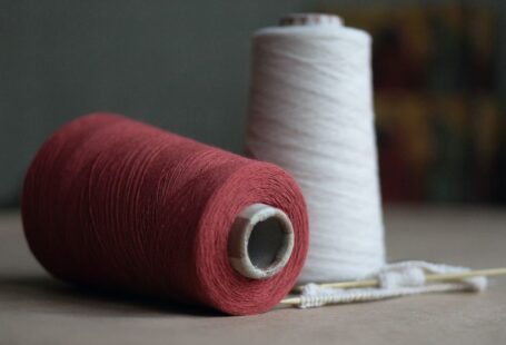 Yarn Tools - red thread on white paper