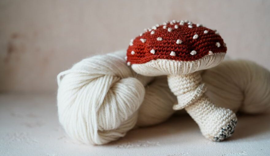 Yarn Tools - a white ball of yarn with a red mushroom on top of it