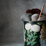Yarn Tools - a can of yarn with a skein of yarn in it