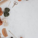 Yarn Tools - silver necklace on white surface