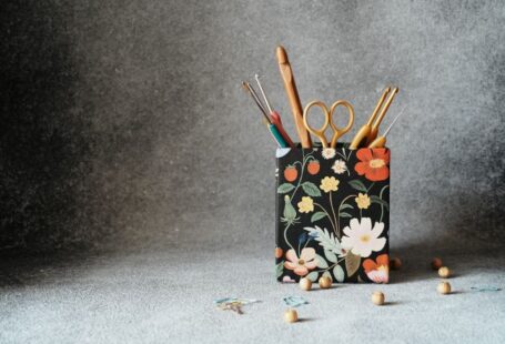 Yarn Tools - a pencil holder with scissors and a pair of scissors in it