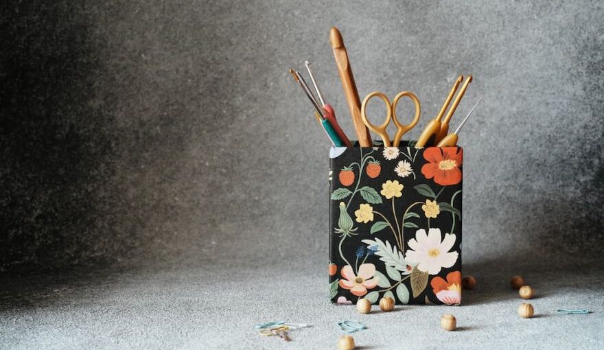 Yarn Tools - a pencil holder with scissors and a pair of scissors in it