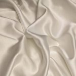 Silk Satin - white textile on brown wooden table