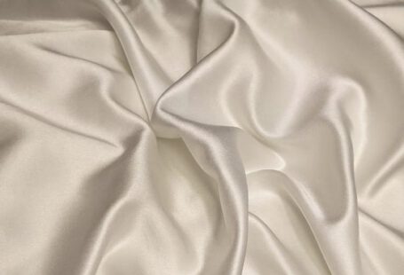 Silk Satin - white textile on brown wooden table